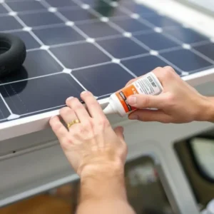 Installing flexible solar panel using marine adhesive sealant